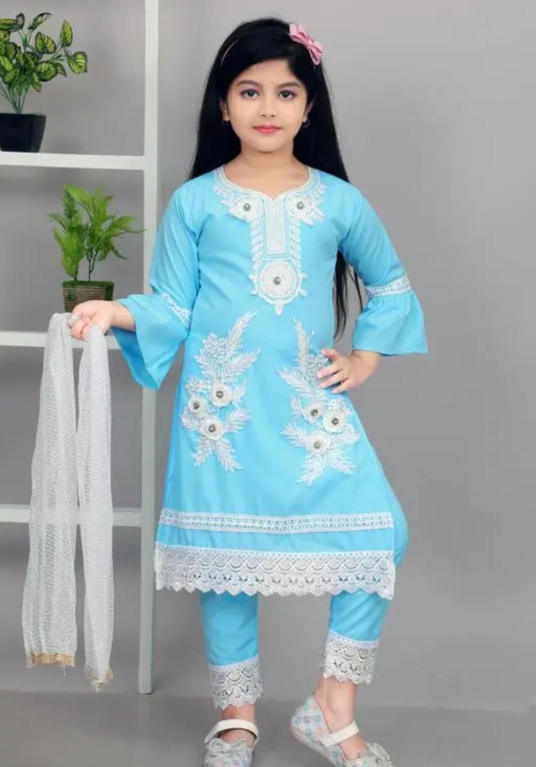 Elegant sky blue embroidered girls’ suit with white lace, matching trousers, and dupatta – perfect for festive and special occasions.